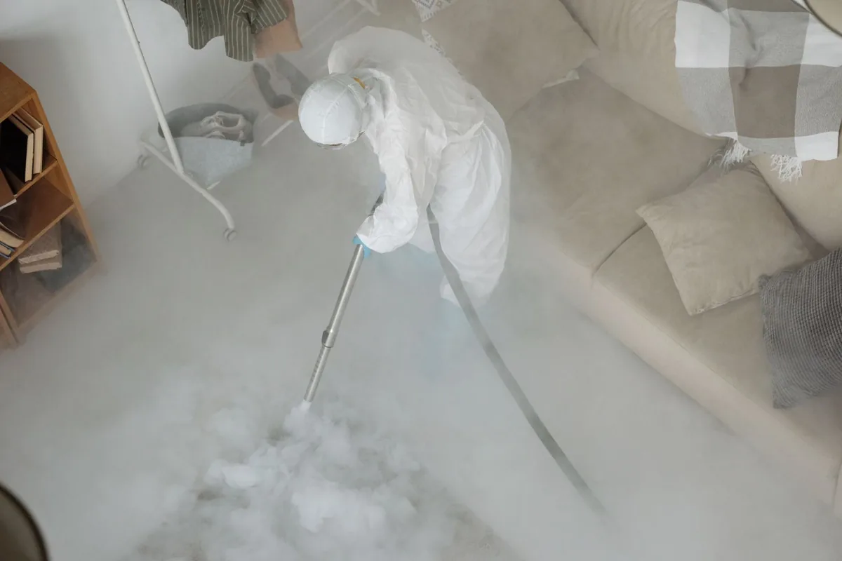 Biohazard cleanup technician in protective equipment, West Van Lear, KY
